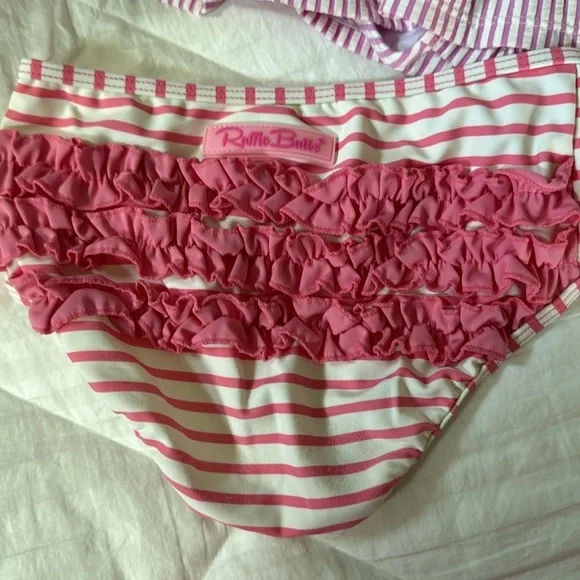 3 bikini bottoms and one bikini and swim shirt. These are all sold as a set - Picture 3 of 5
